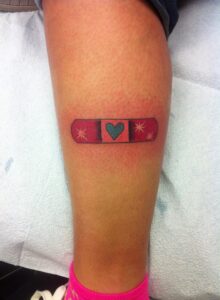 christian bandaid tattoo