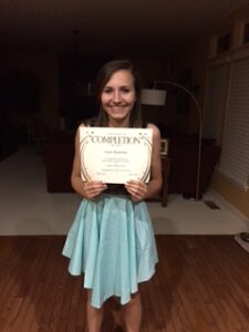 emily holding certificate
